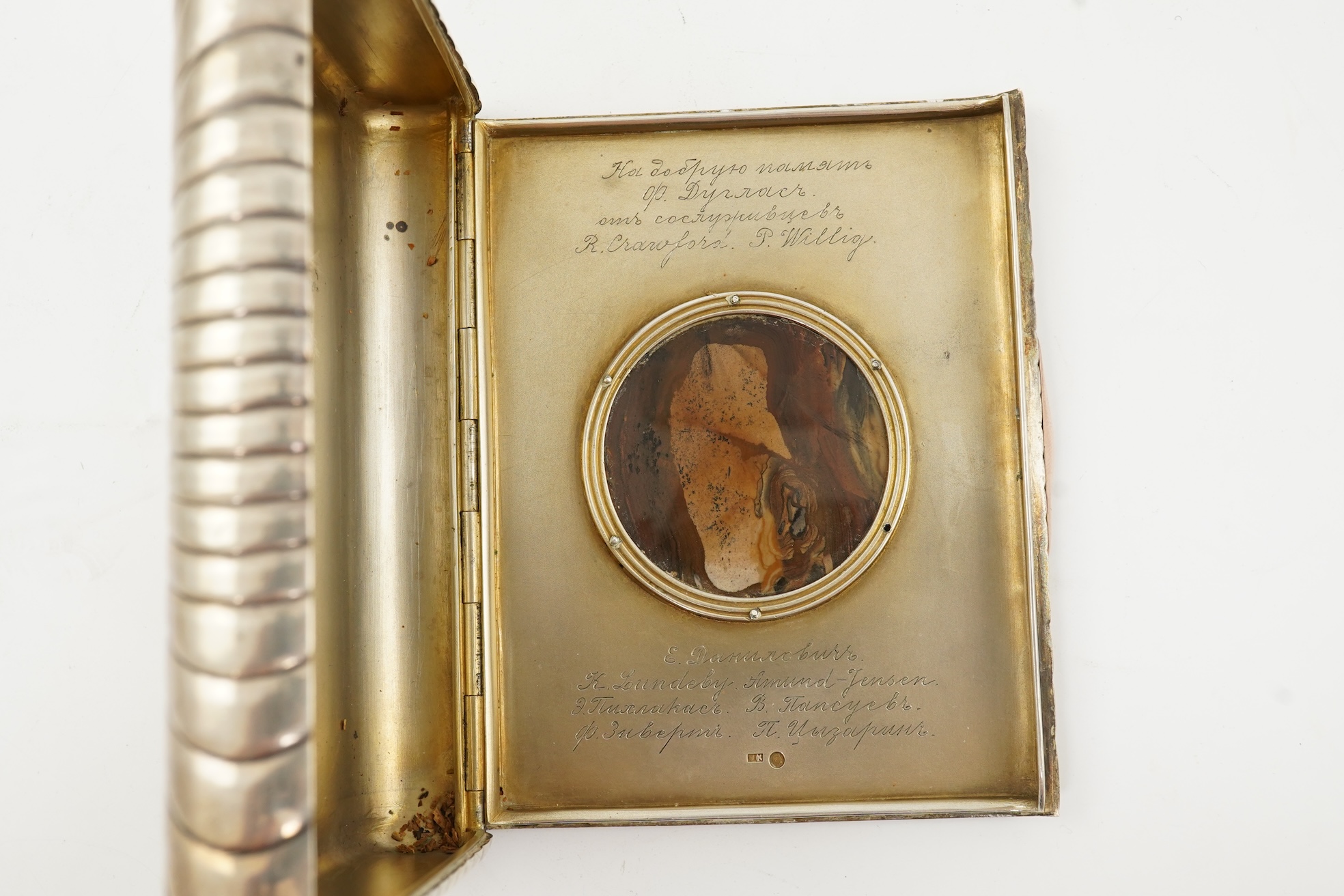 An early 20th century Russian 84 zolotnik silver cigarette case, with cappuccino agate inset cover, of ribbed rectangular form